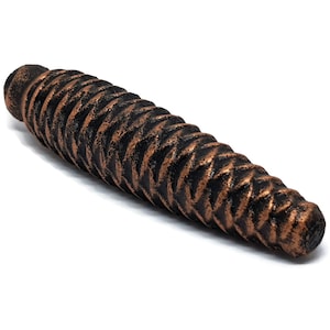 May include: A long, dark brown, textured, metal, decorative piece with a spiral design. The piece has a copper finish.
