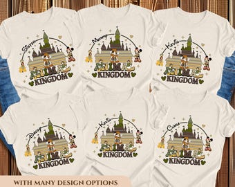 May include: Cream-colored t-shirts with a cartoon design featuring a castle, Mickey Mouse, and the words "Animal Kingdom." Each shirt has a different name above the design, such as "Sister," "Mommy," and "Kevin."