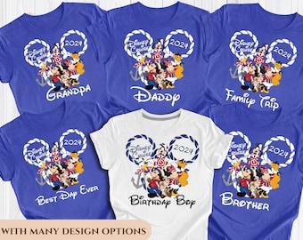 May include: Set of six blue and white t-shirts with a Mickey Mouse design and the text "Disney Cruise 2024". The shirts have different text on the front, including "Grandpa", "Daddy", "Family Trip", "Best Day Ever", "Birthday Boy", and "Brother".
