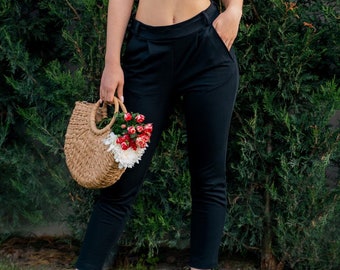 Pantalones pitillo de algodón orgánico: pantalones negros de talle alto con bolsillos.