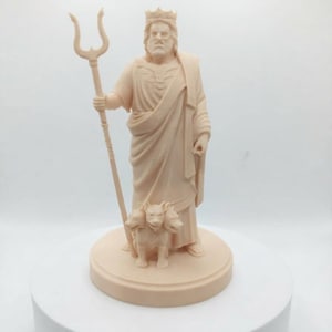 May include: A monochromatic beige figurine of a bearded figure wearing a crown and draped robes, holding a three-pronged trident in the right hand. A three-headed dog stands at the feet of the figure, all mounted on a circular base.