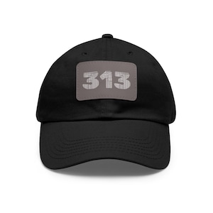 May include: Black baseball cap with a gray patch featuring the number 313 in a stylized font.