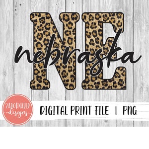 May include: Digital print file featuring the letters "NE" in a leopard print design, with the word "Nebraska" in a cursive font. The design is set against a white and gray wood-grain background. The image also includes the text "DIGITAL PRINT FILE I PNG".