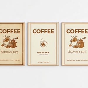 May include: Three framed coffee-themed posters. The posters feature the word "COFFEE" in a brown, vintage font. One poster says "Roasters & Café", another "Brew Bar", and the third "Roasters & Café". Each poster has a coffee-related illustration.