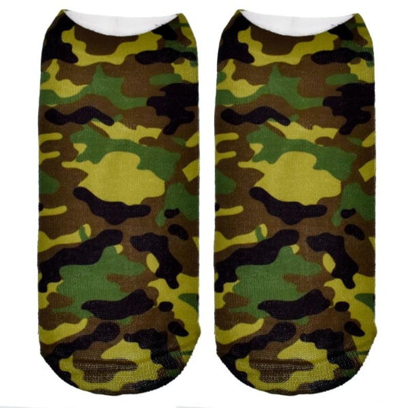 May include: A pair of ankle socks with a camouflage pattern in shades of green, brown, and black.