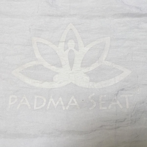 Padma Seat Yoga Belt . Spinal support for prolonged comfortable cross legged sitting....meditation, yoga, outdoor concerts white & white logo