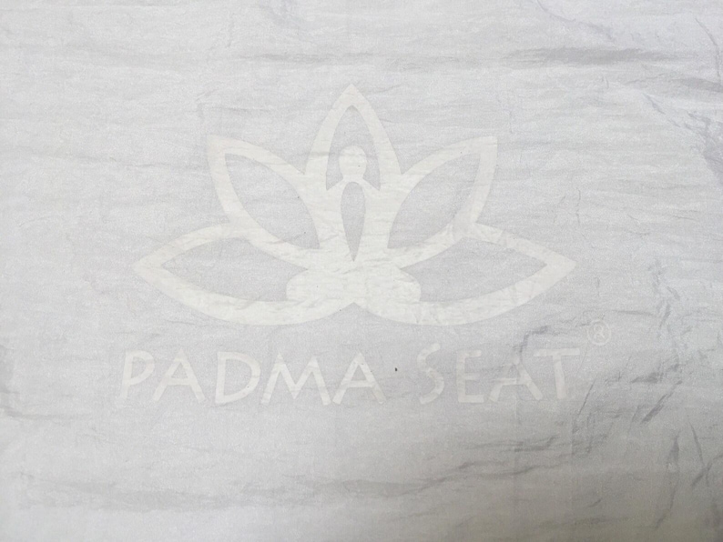 Padma Seat Yoga Belt . Spinal support for prolonged comfortable cross legged sitting....meditation, yoga, outdoor concerts white & white logo