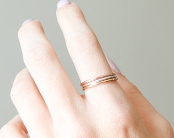 SET of FOUR stackable ring bands. minimalist stack ring. textured, hammered, smooth. 14k gold filled, rose filled, sterling silver. 1.3mm