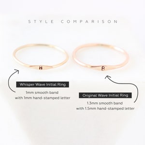 Image and text comparison of two stackable gold initial bands showing the slimmer 1 mm version and the slightly thicker 1.3 mm ring band with a tiny letter on each band.