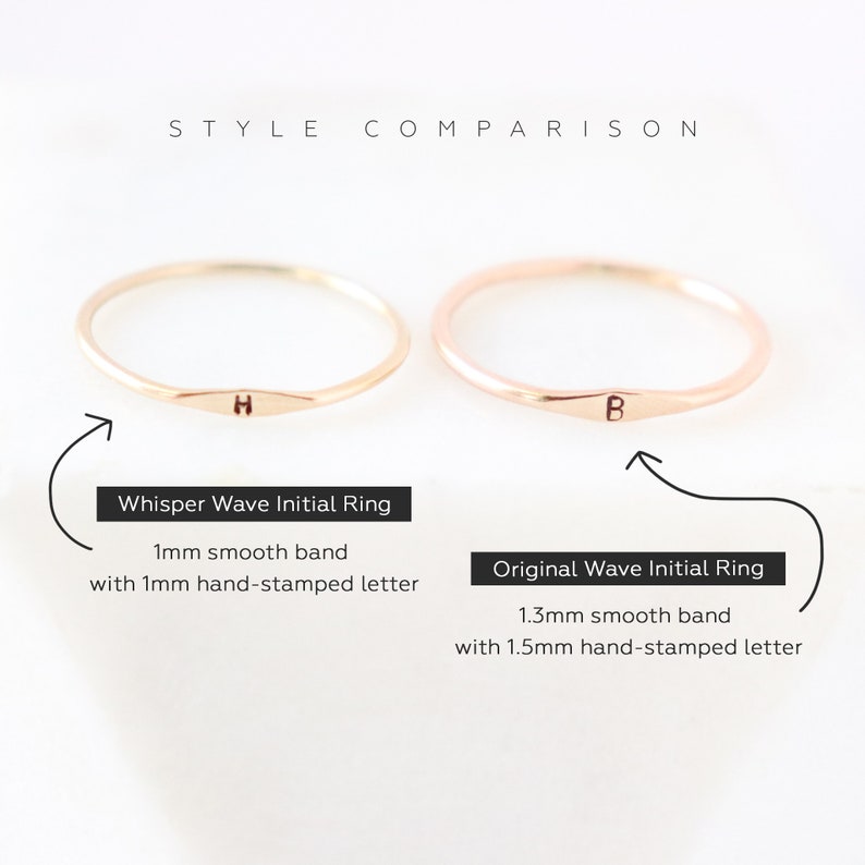 Image and text comparison of two stackable gold initial bands showing the slimmer 1 mm version and the slightly thicker 1.3 mm ring band with a tiny letter on each band.