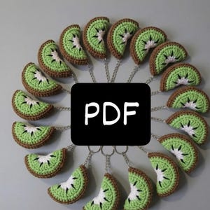 May include: A collection of crocheted kiwi fruit keychains arranged in a circle. Each keychain features a green and brown kiwi slice with white and black details. The word "PDF" is displayed in white text on a black square.