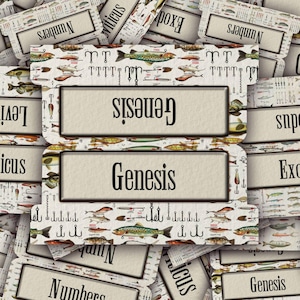 May include: A collection of vintage-style file folder labels with the word "Genesis" prominently displayed. The labels feature a fish and fishing hook pattern. Other labels with text are also visible.