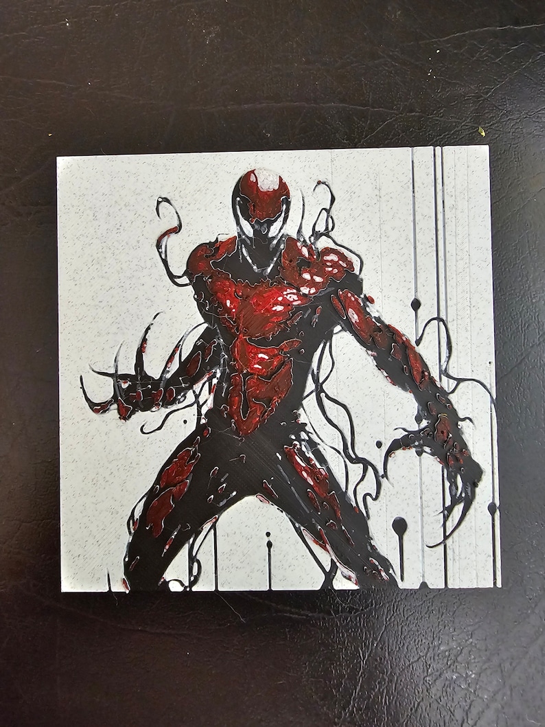 May include: A black and red illustration of a superhero character with sharp claws and a menacing expression. The character is depicted against a white background with black splatters.