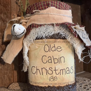 Olde Cabin Christmas 1819 with white grungy bell.  Handmade Primitive grubby pantry jar, grubby distressed pantry jar, primitive grungy jar.