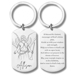 May include: Silver keychain with a prayer to St. Gabriel on one side and a drawing of an angel with the name Allison on the other side.