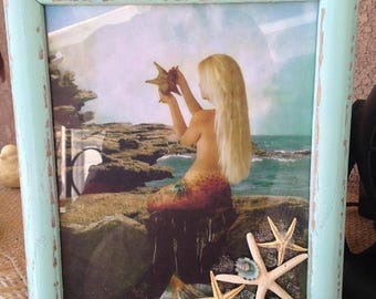 Mermaid on cliff in 8 x 11 standing teal frame