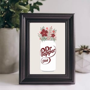 May include: A framed print of a white can of Diet Dr Pepper with a bouquet of red and pink flowers in the top. The can has the words "Dr Pepper" and "Diet" printed on it.