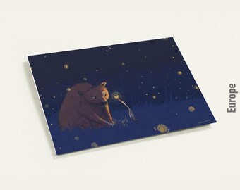 May include: A square art print featuring a brown bear and a small, glowing creature in a starry night scene. The artwork has a whimsical, illustrative style with a dark blue background and yellow accents. The word "Europe" is printed on the side.