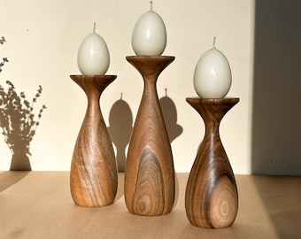 Walnut candle holders for rustic homes. Wooden decor bringing warmth charm into cozy interiors