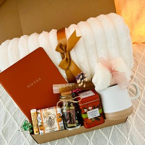 Hug In A Box | Encouragement Gift, Hygge Gift Box, Thinking of You Care Package with Blanket, Mug & Treats | Cozy Self Care Basket for Her