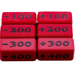 Close up of a full set 100-400 Attack Increase/Decrease Markers shown in Ruby/Black