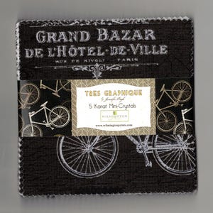 May include: A black fabric square with a white design of bicycles and the text "GRAND BAZAR DE L'HOTEL-DE-VILLE MUZ DE NIVOLI FARIS" and a label that reads "TRES GRAPHIQUE by Jennifer Page 5 Karat Mini-Crystals WILMINGTON www.wilmingtonprints.com"