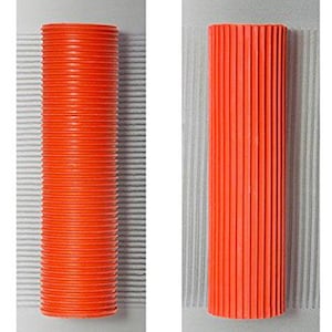 May include: Two orange textured rollers for painting. The roller on the left has a wavy texture and the roller on the right has a straight texture.
