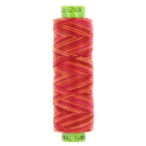 May include: A spool of thread with a vibrant mix of orange, pink, and yellow hues. The thread is tightly wound, creating a textured appearance. The spool has green end caps with the text "Col. EZM29" and "UnderFill Thread".
