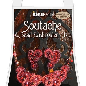 May include: A kit for making a red soutache necklace and earrings. The kit includes instructions for making the jewelry, which features a vintage gems arabesque design.