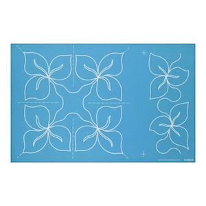 May include: Blue quilting template with white lines outlining a flower design. The template is divided into four sections with a dashed line. The template also includes two smaller flower designs on the right side. The text "E30663" is in the bottom right corner.