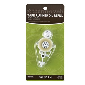 May include: A white tape runner refill for a tape dispenser. The refill is packaged in a clear plastic case with a green background. The packaging includes the text "therm-o-web TAPE RUNNER XL REFILL" and "50ft (15.2 m)".