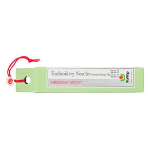 May include: A green and white package of Tulip embroidery needles. The package is labeled "Embroidery Needles Assorted Sharp Tip" and "HIROSHIMA NEEDLES".