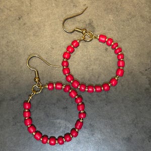 Red beaded earrings with gold accent