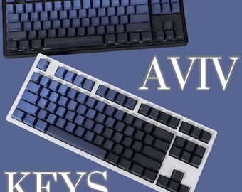 May include: Two keyboards with blue and black keycaps. The top keyboard is black with a blue and black keycap set. The bottom keyboard is white with a blue and black keycap set. The text "AVIV KEYS" is visible in the image.