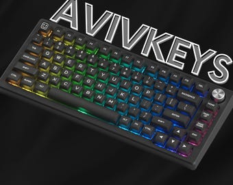 May include: A black mechanical keyboard with backlit keys displaying a rainbow gradient. The keyboard has a black wrist rest and a silver knob. The text "AVIVKEYS" is displayed above the keyboard.
