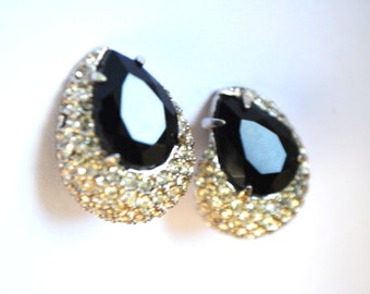 Luxurious vintage 80s clear rhinestones with tear drop shape, art deco style clip on earrings with a black stone as a centerpiece.