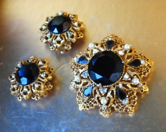 1960 vintage , glamour , gold tone metal filigree  jewelry set  with faceted black stones, faux pearls, aurora borealis. By Florenza.