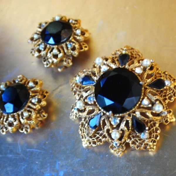 1960 vintage , glamour , gold tone metal filigree  jewelry set  with faceted black stones, faux pearls, aurora borealis. By Florenza.