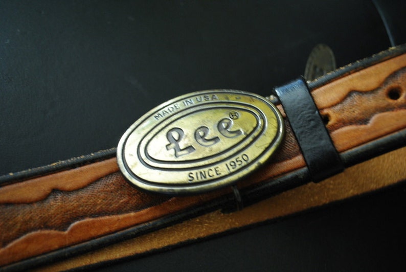 Boho vintage 70s caramel brown, genuine tooled leather, womens belt with oval shape, brass ,Lee buckle. image 3