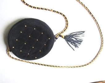 Stylish vintage 1980, black suede   round , cross body ,  quilted hand bag with a   tassel , studs a long woven handle  chain.