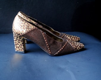 Stylish  vintage1980s animal print mixed leather high heels with a studs. Made by J. Renee. Size 7M