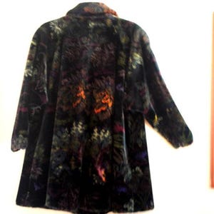 Stylish vintage 1980s, black faux fur, swing coat with a muted multicolor exotic floral print. By Donnybrook. USA. Size M/L