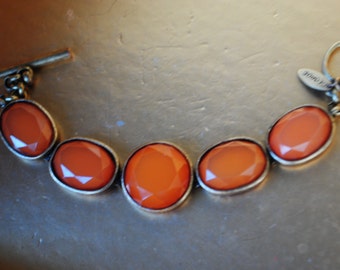 Vintage 80s faux amber ,  oval and round shape cabochon bracelet. Made by George.