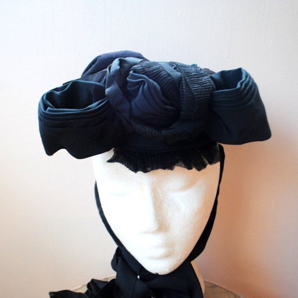 Authentic Civil War , vintage 1860s, black, combine  layered fabric, women's  hat with a   flower-bow, pleats, ribbons, ruffles.Size 21.