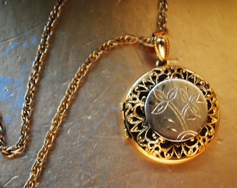 Victorian style vintage 1970, gold tone metal necklace  with a round , double layers  locket, dome  pendant.