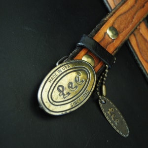 Boho vintage 70s caramel brown, genuine tooled leather, womens belt with oval shape, brass ,Lee buckle. image 2