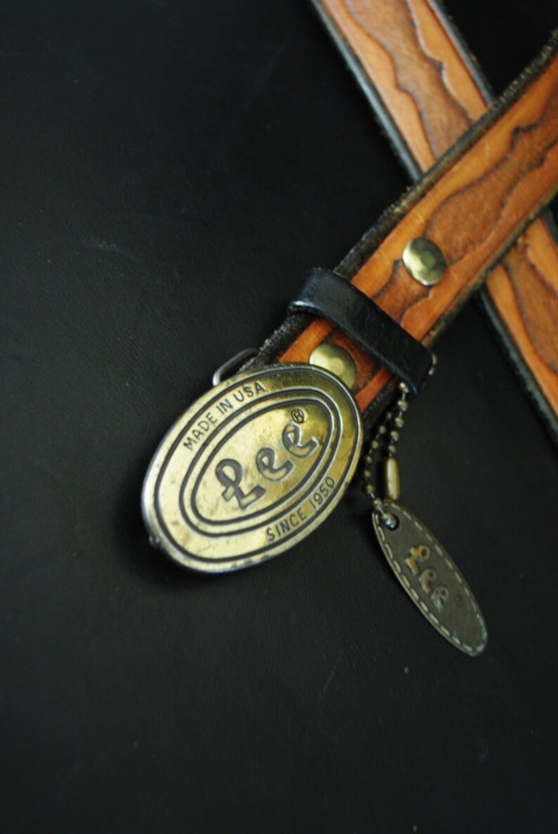 Boho vintage 70s caramel brown, genuine tooled leather, womens belt with oval shape, brass ,Lee buckle. image 2