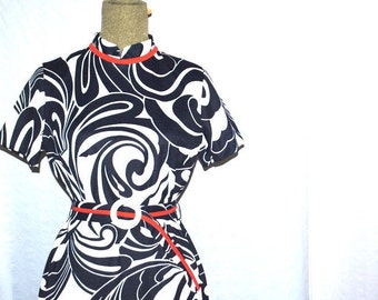 Mod vintage 60s,  textured polyester dress with a white, navy blue color abstract, geometric swirl  design. Red trim. By Flutterbye. Size M.