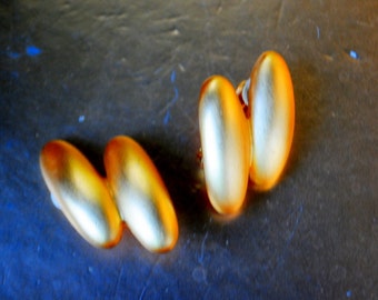 Mod style vintage 80s bold gold tone metal clip on earrings.  Authentic Givenchy.  Paris- New York.