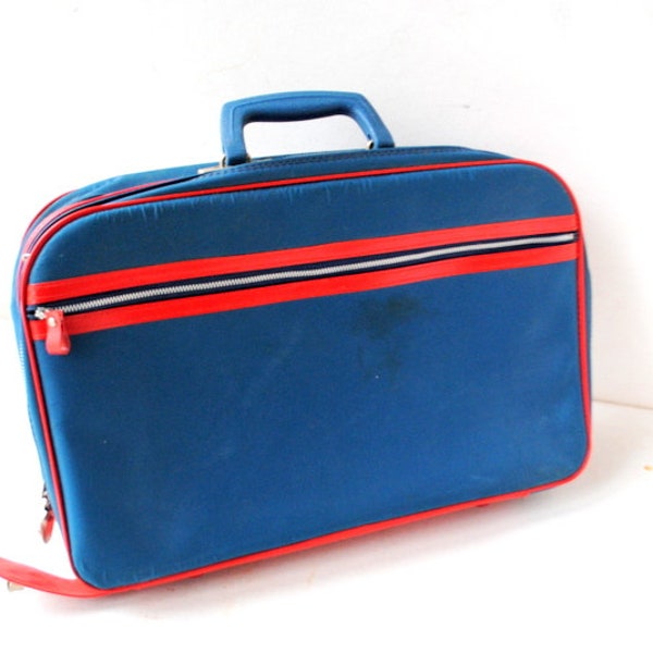 1960 vintage , navy blue nylon  , small traveling  suitcase  with    red vinyl  details, metal  zipper. By  Bantam,  Japan.